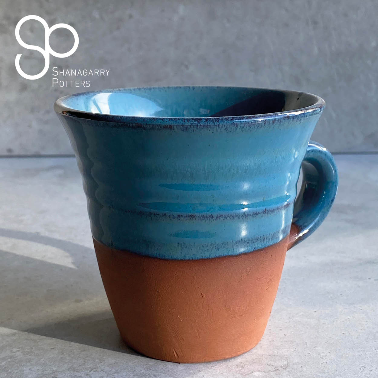 Irish Handmade Pottery Blue on Red Flared Mug